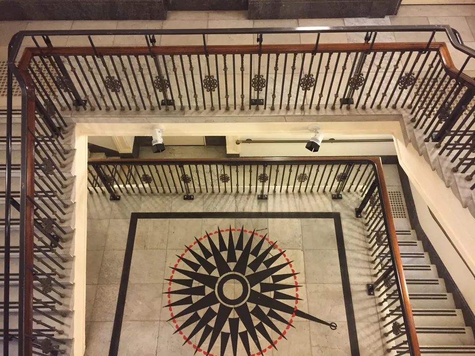 Looking down the stairwell of the State Library of Victoria onto its mosaic floor